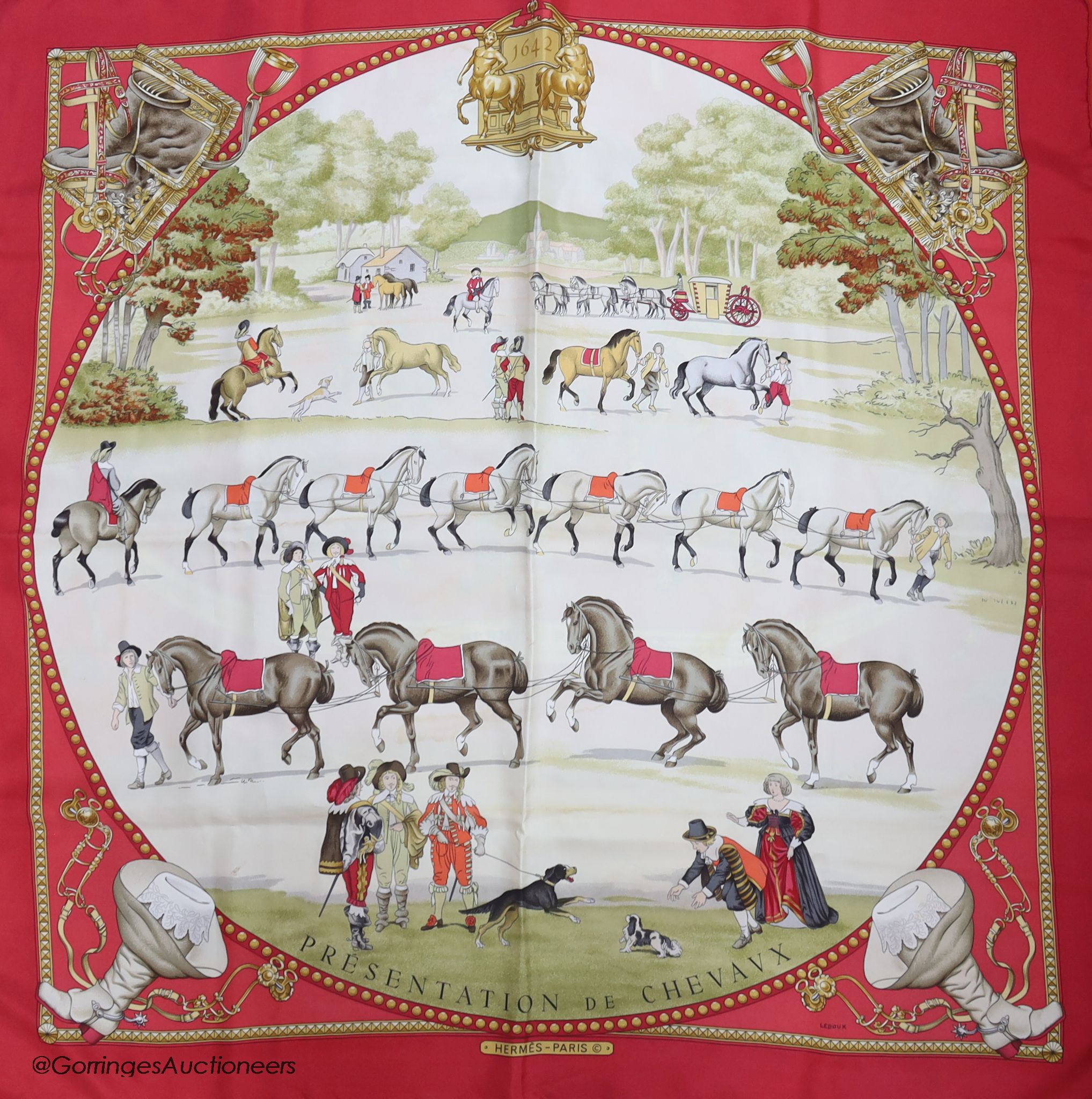 Three vintage Hermes silk scarves, 'Grand Apparat' (red, black and gold), 'En Piste' (red ground) and 'Presentation de Chevaux'